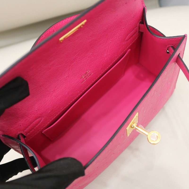 E5 Rose Tyrien ostrich kelly pochette with ghw